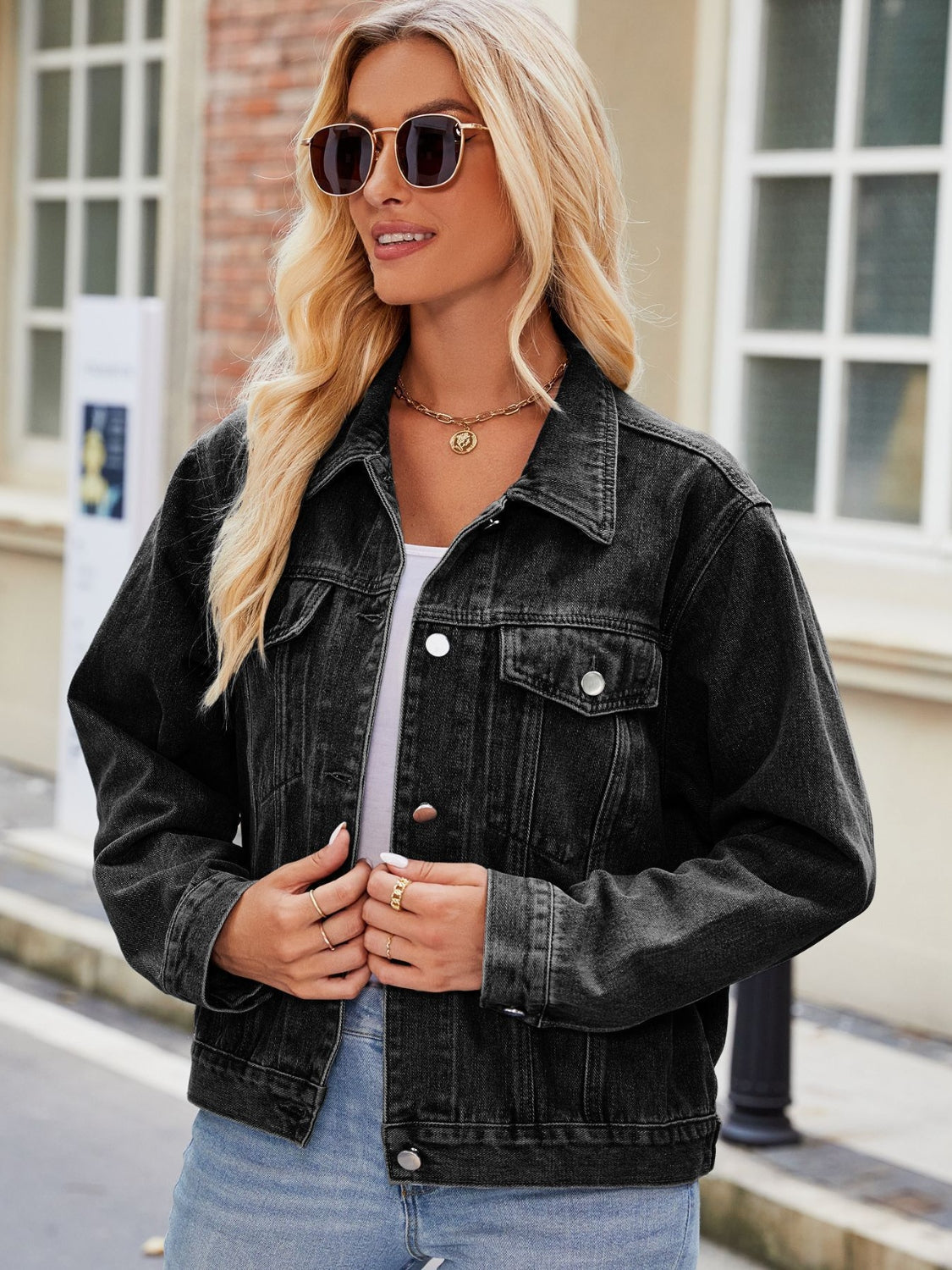 Faded black denim boxy fit jacket with button front and collar.