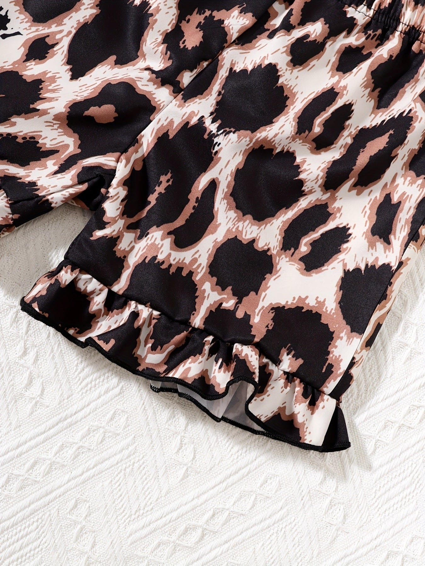 Baby leopard print shorts with ruffled hem detail