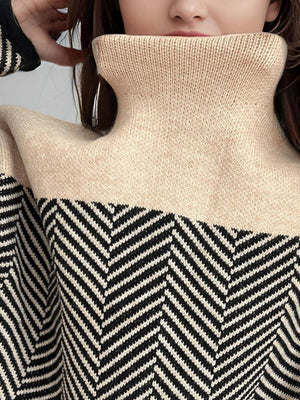 Chevron knit turtleneck sweater in tan with black chevron pattern and ribbed collar.