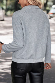 Textured henley sweatshirt in cloudy blue with button detail.