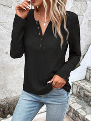 Textured black long sleeve henley top with button placket and v-neck