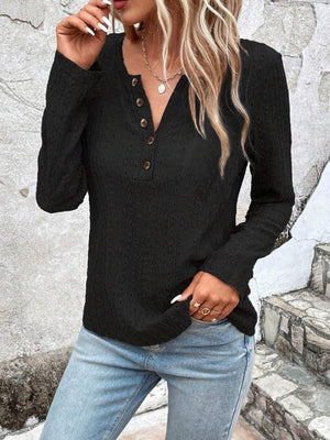 Textured black long sleeve henley top with button placket and v-neck