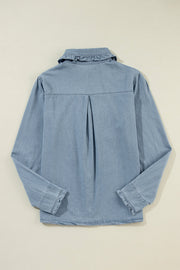 Indigo button-up blouse with ruffled collar and frayed hem.