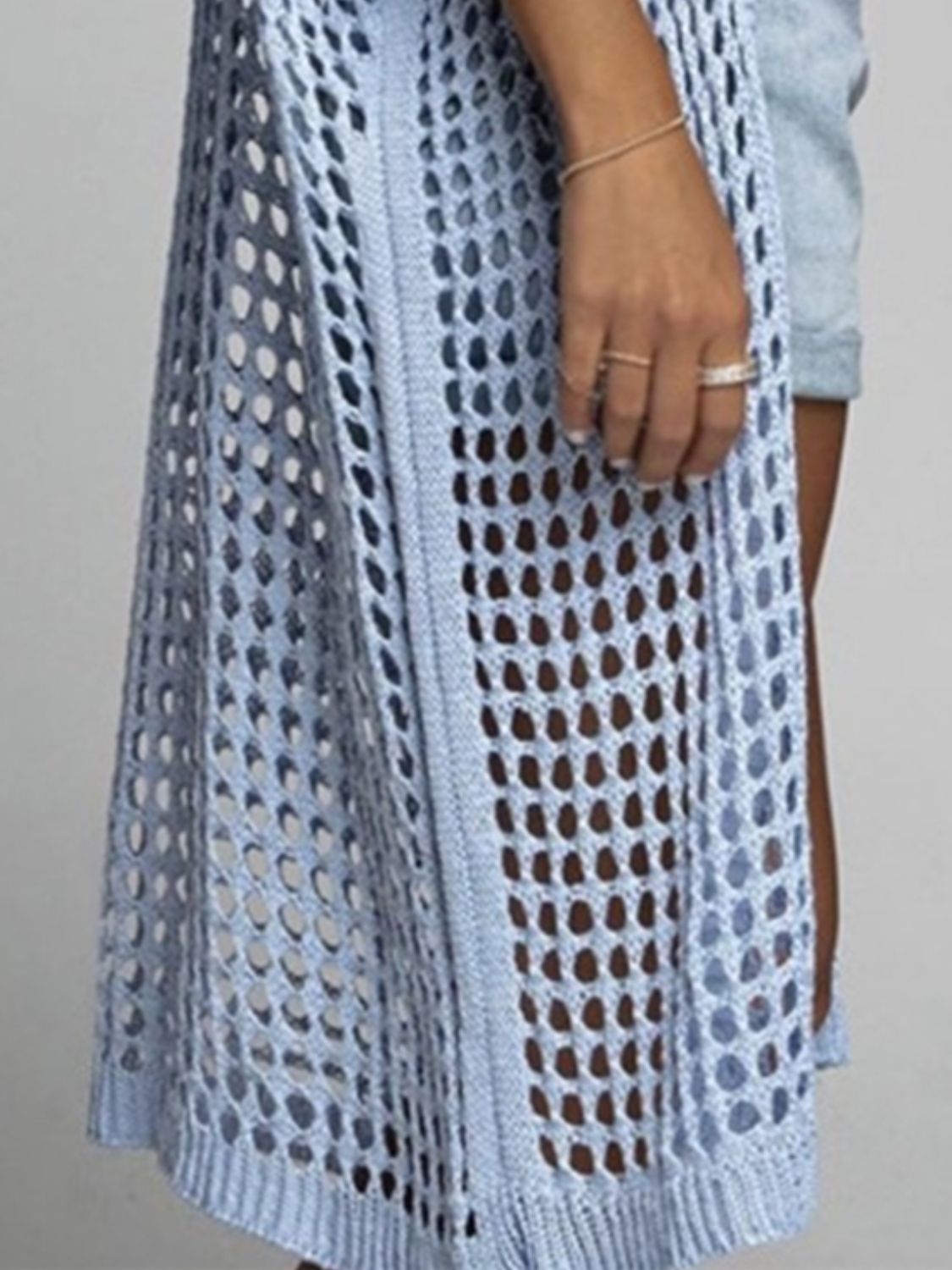 Light Blue open-knit duster cardigan with a breathable acrylic blend and a relaxed fit.