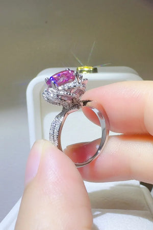 Crimson Bloom moissanite halo ring in cerise with diamond band detail.