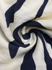 Chic smocked tube romper in navy and white stripe fabric.