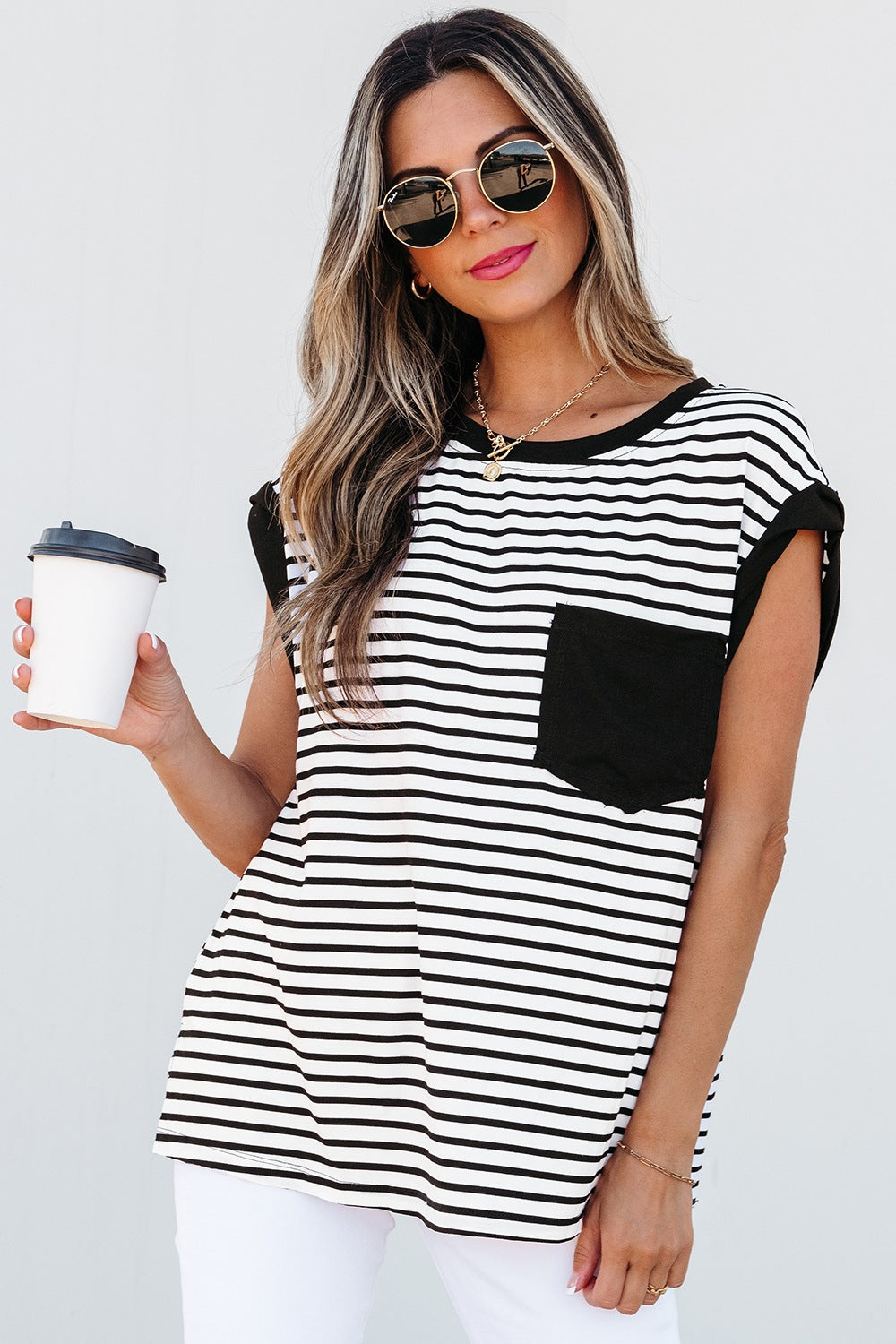 Black and white striped t-shirt with a black pocket detail and crew neck.