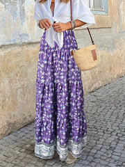 Purple floral maxi tiered skirt with border print hem.
