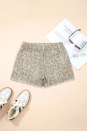 Denim shorts with leopard print, frayed hem, and elastic waistband.