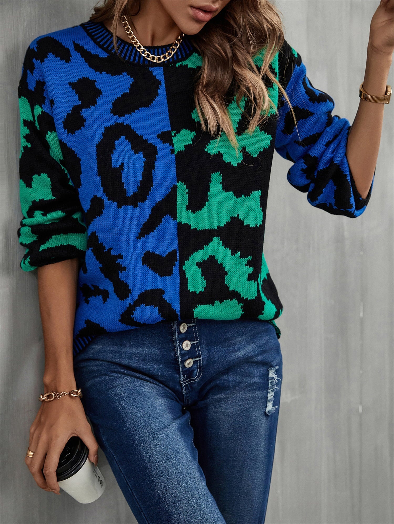 Split leopard knit sweater in blue/green with statement sleeves and crew neck.