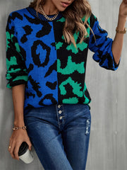 Split leopard knit sweater in blue/green with statement sleeves and crew neck.