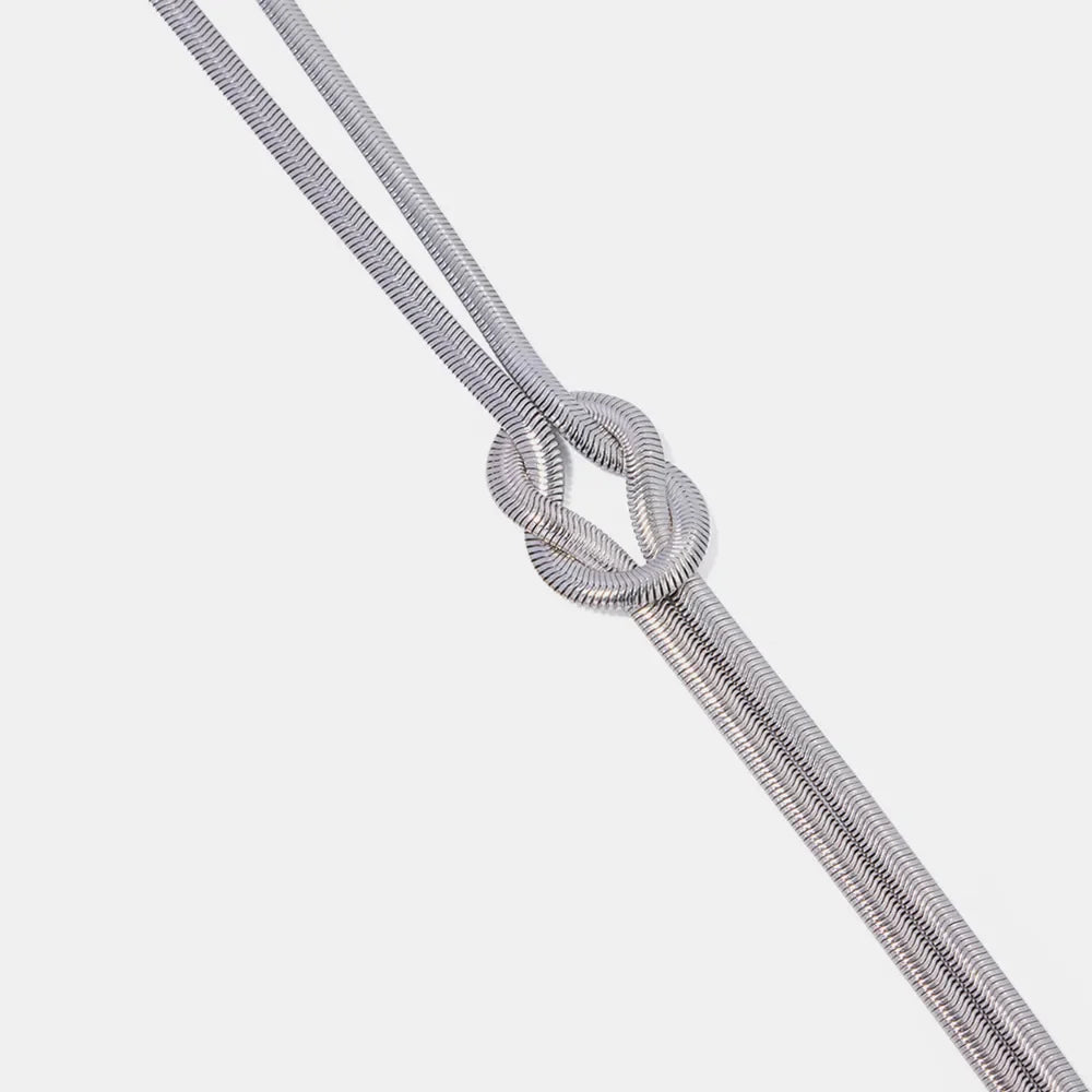 Silver herringbone knot necklace with a flat, sleek chain.