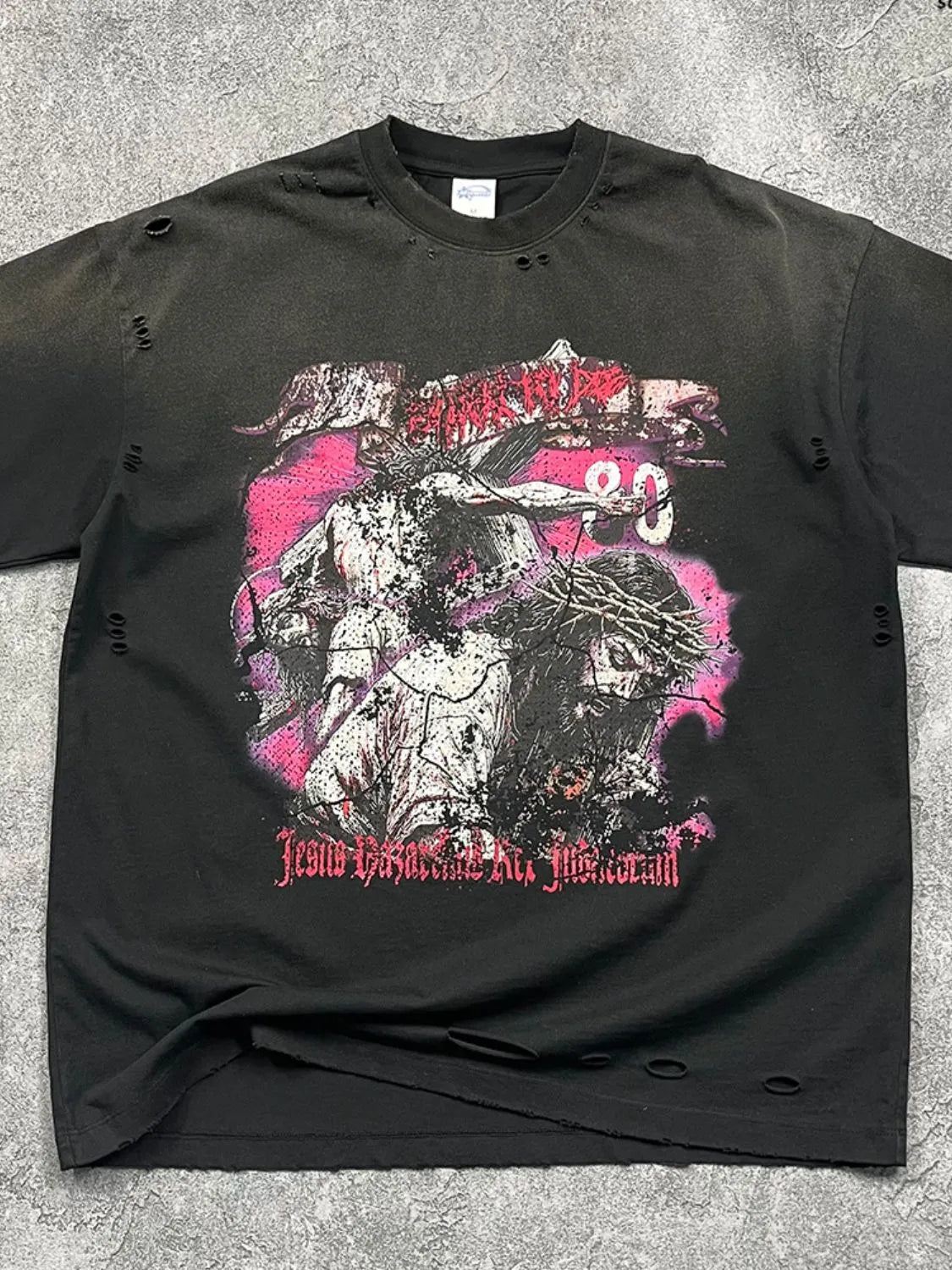 Black oversized ripped graphic tee with Jesus crucifixion print and distressed details.