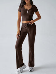 Brown button-front crop top and flared lounge pants with drawstring waist.