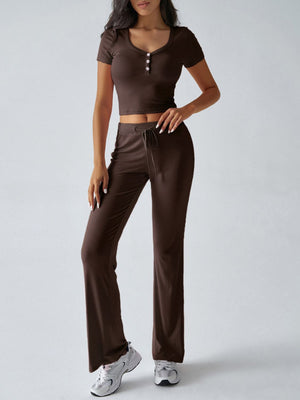 Brown button-front crop top and flared lounge pants with drawstring waist.