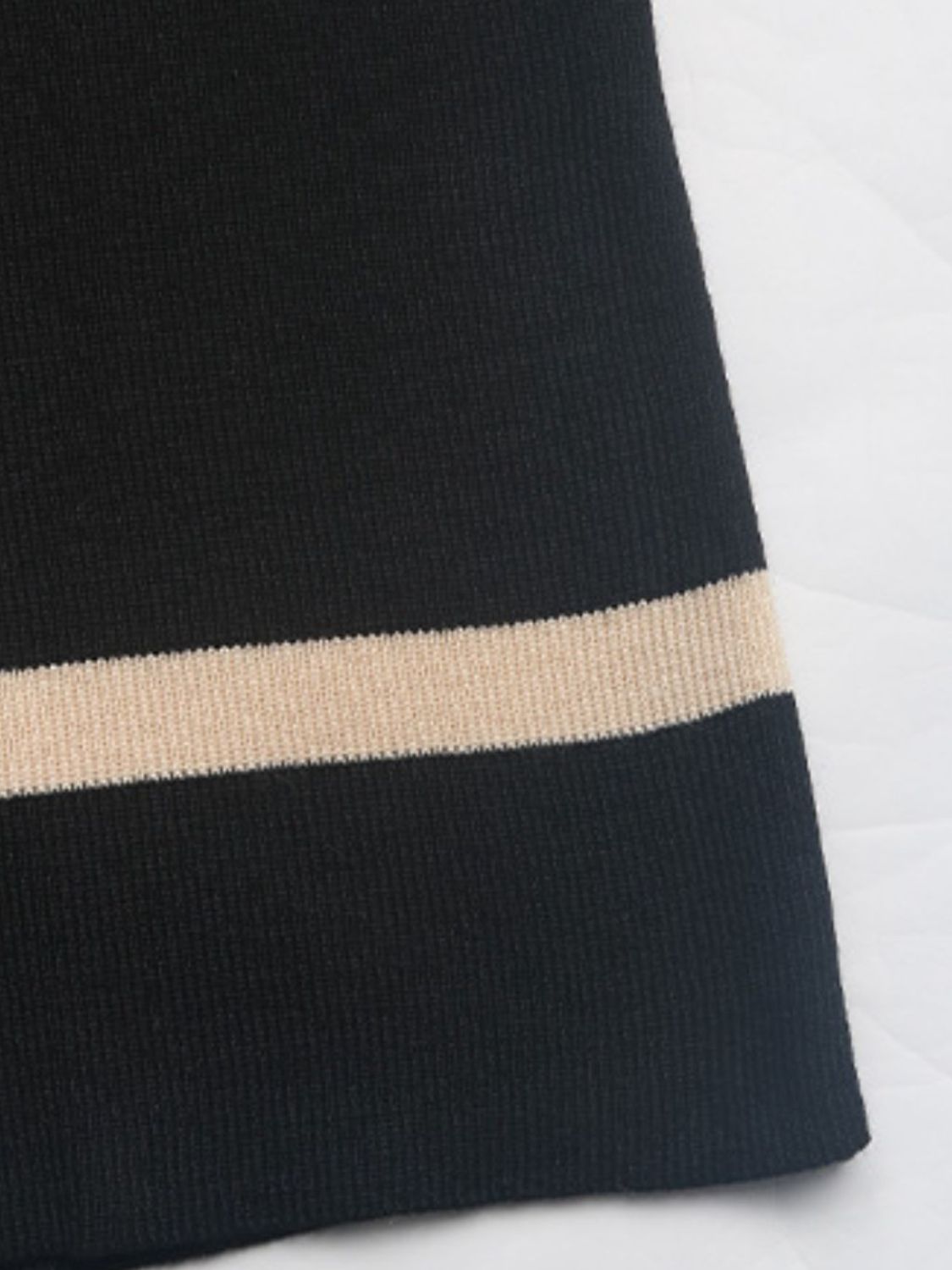 Black knit set with contrast tan stripe detail