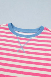Short sleeve tee with pink and white stripes, blue neckline, and contrast stitching detail.