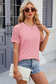 Pink ribbed tee with lace raglan sleeves and pintuck detail.