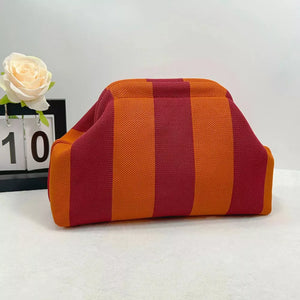Vibrant knit clutch with striking red and orange stripes