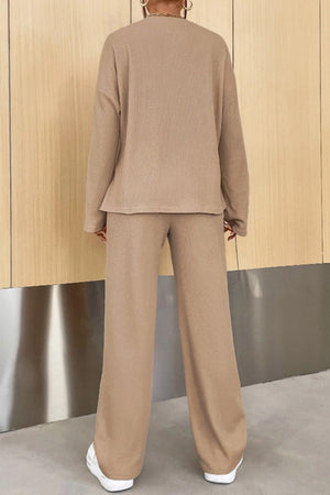 Camel ribbed knit henley set with relaxed fit long sleeve top and wide leg pants.