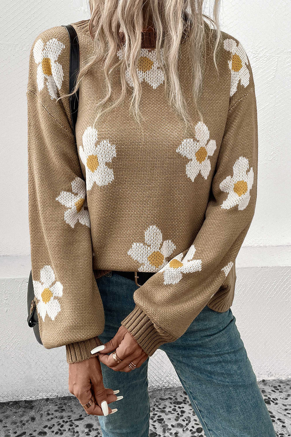 Khaki acrylic sweater with white daisy motif and balloon sleeves.