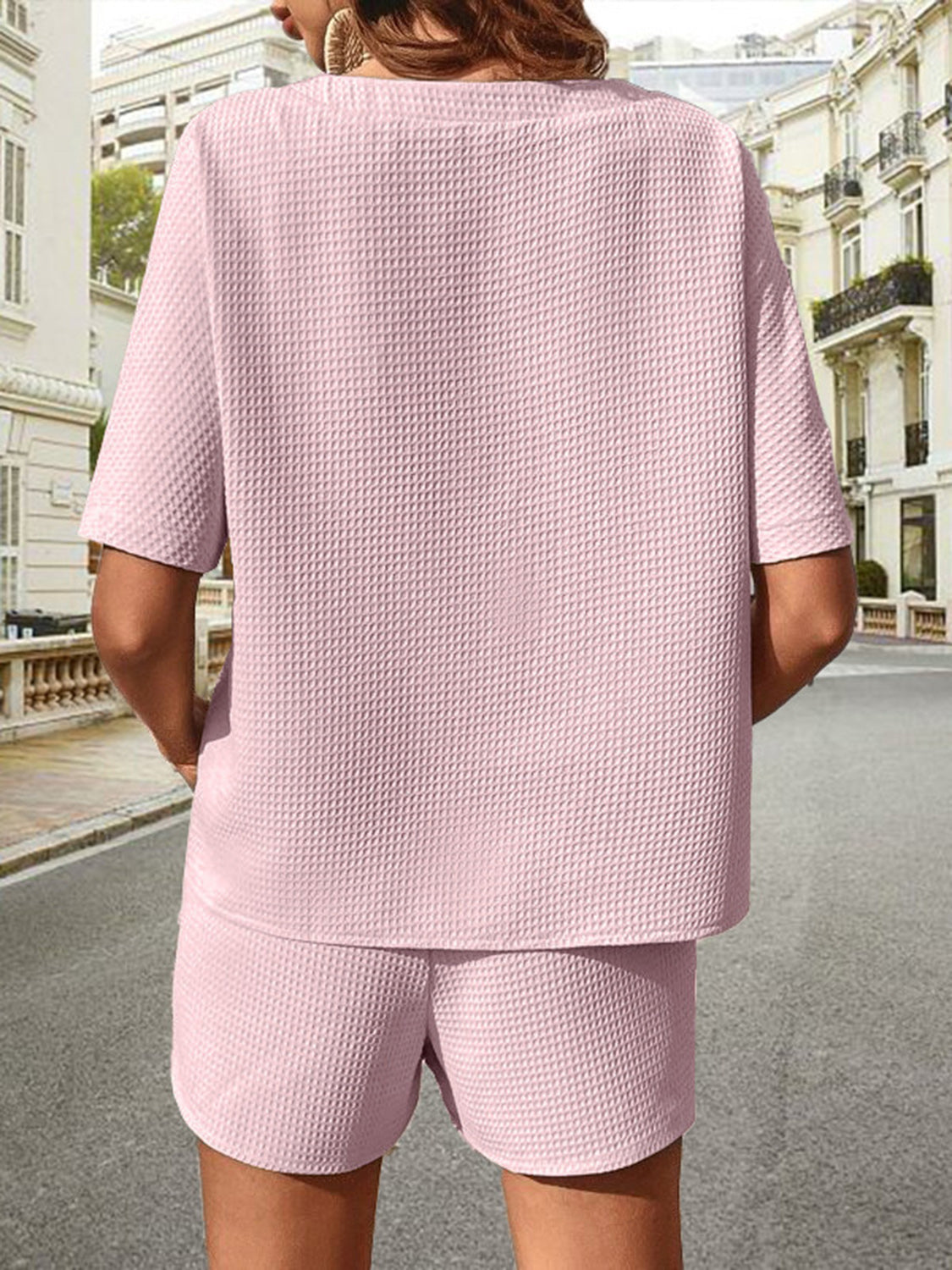 Pink waffle knit drawstring co-ord set with short sleeves and shorts.