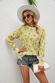 Light Yellow heart print drop shoulder sweater with crew neck and long sleeves.