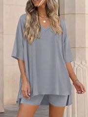 Gray V-neck two-piece set with oversized short-sleeve top and shorts.