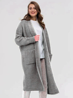 Gray oversized knit cocoon cardigan with pockets and ribbed cuffs.
