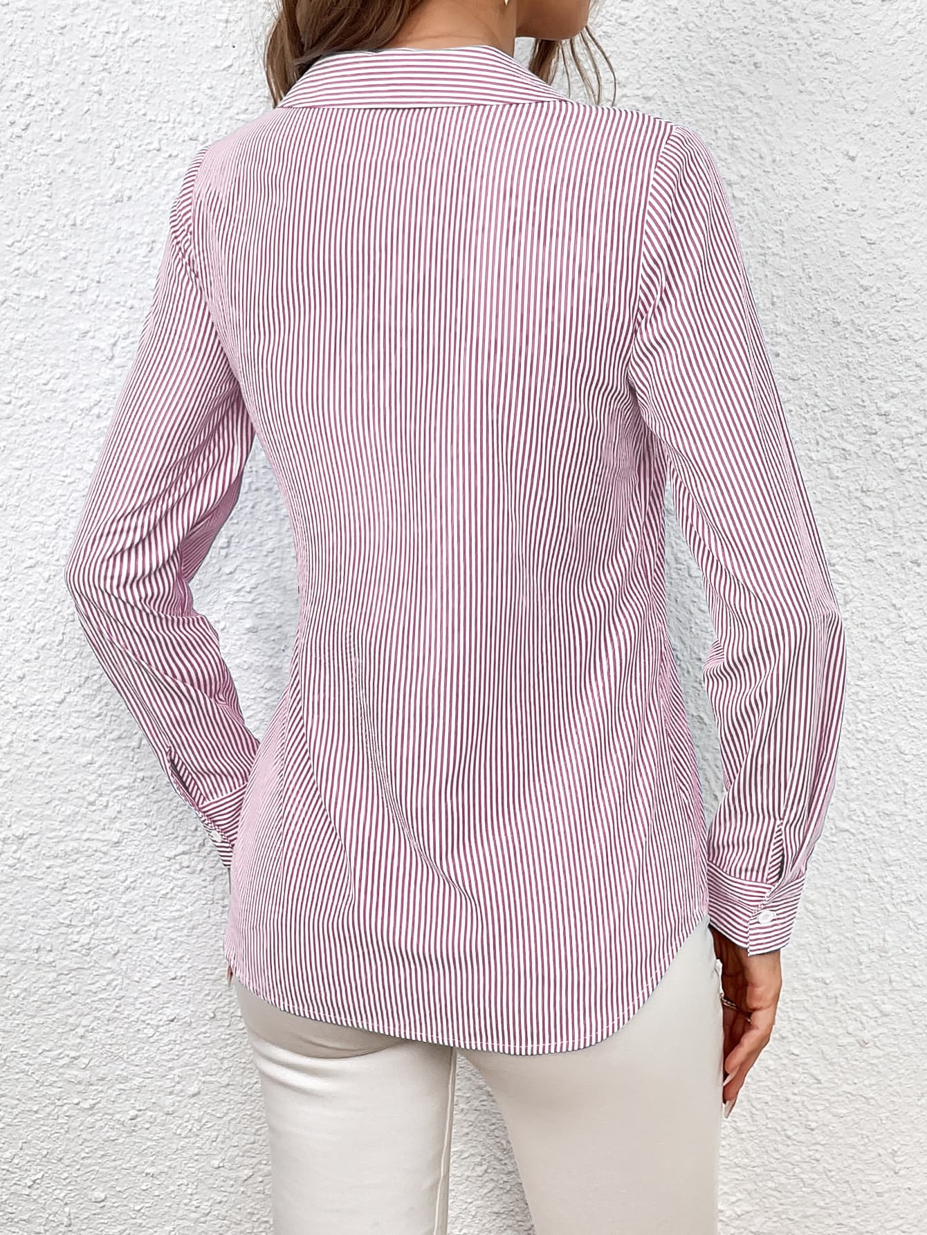 Blush pink and white striped wrap blouse with button cuffs and a collared neckline.