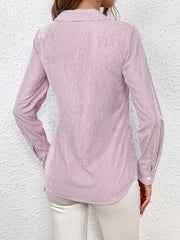Blush pink and white striped wrap blouse with button cuffs and a collared neckline.