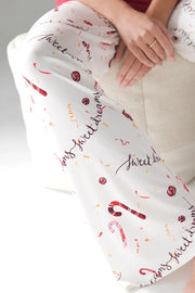 White lounge pants with candy cane and sweet dreams print