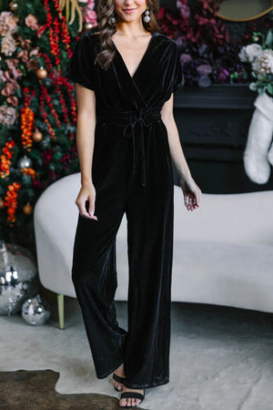 Black velvet wrap bodice jumpsuit with tie waist and wide legs