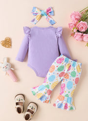 Purple baby bodysuit with ruffled sleeves and Easter egg print bell bottoms.