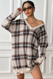 Plaid knit mini dress with distressed hem and V-neck.