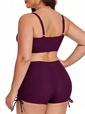 Plus size deep purple adjustable swimwear set with drawstring side shorts and adjustable strap bikini top.