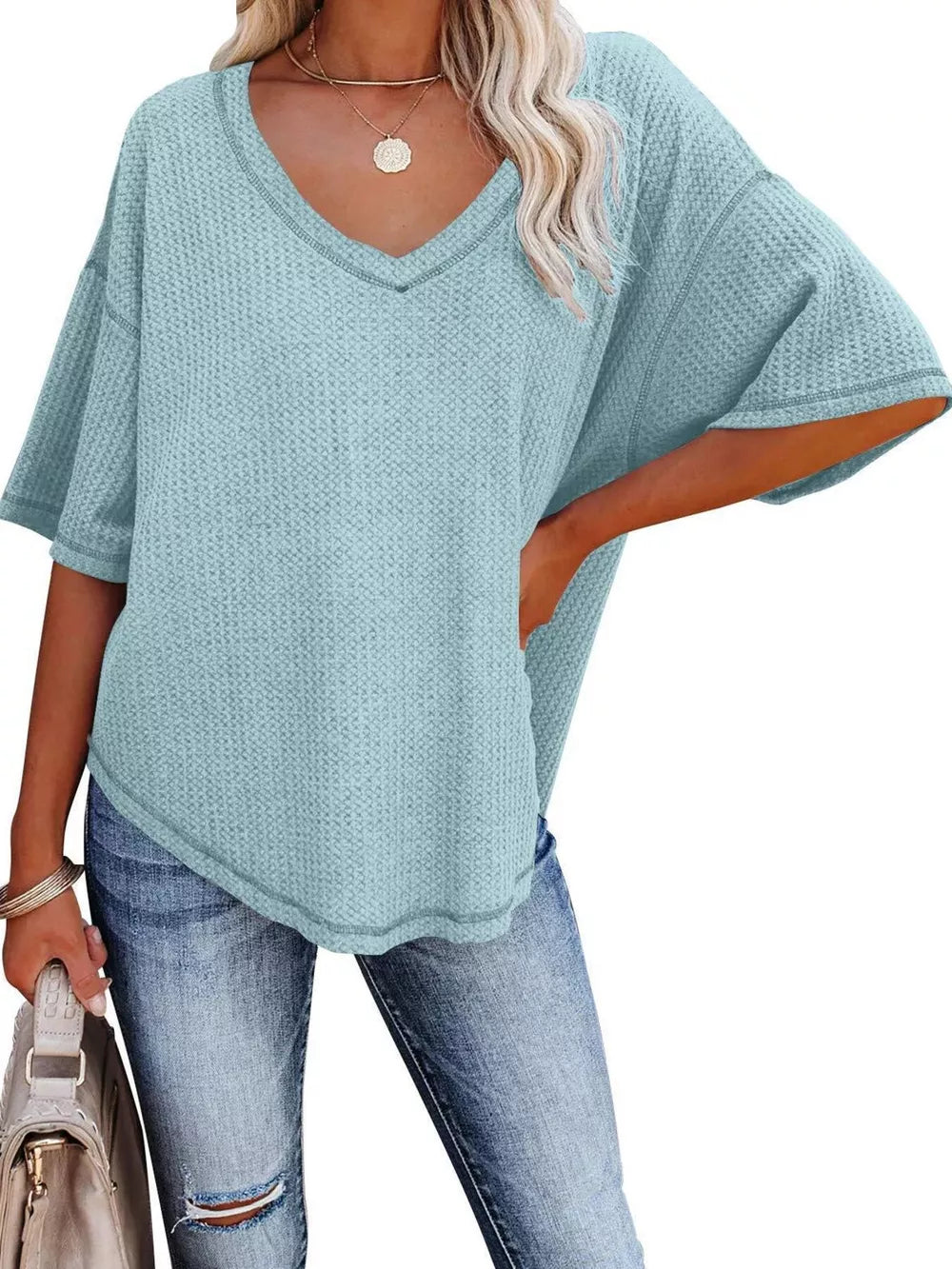 Light blue waffle knit relaxed v-neck t-shirt with short sleeves.