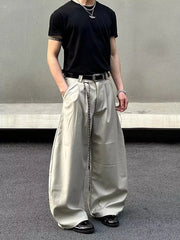 Men's wide leg joggers in apricot with a relaxed fit and pleated front.