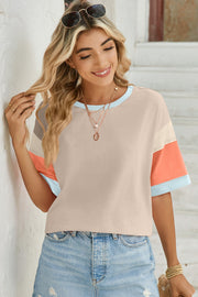 Panel sleeve crewneck tee with colorblock sleeves in beige, grey, coral, and light blue.