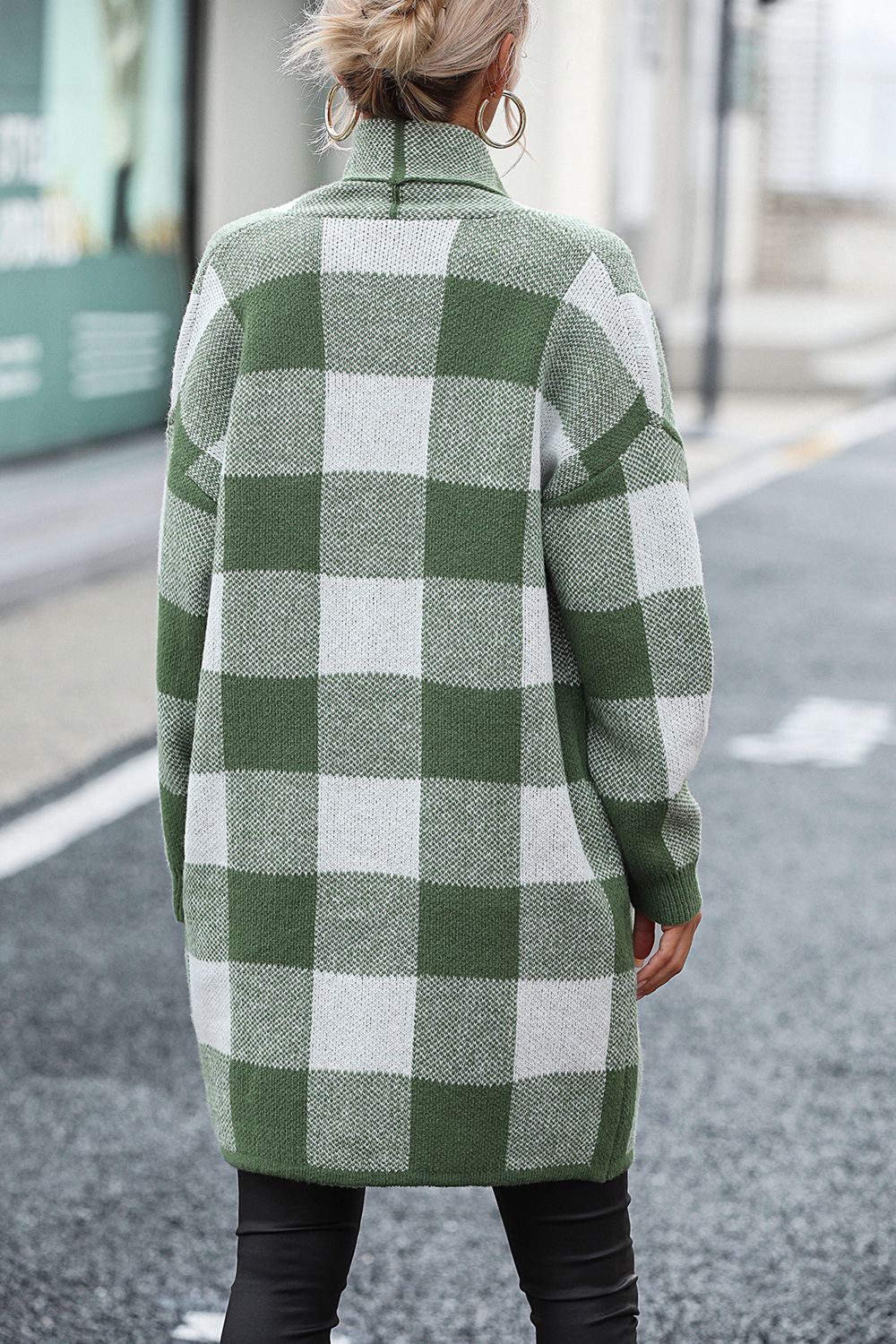 Oversized checkerboard knit duster coat in matcha green and white, with a shawl collar.