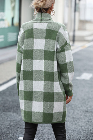 Oversized checkerboard knit duster coat in matcha green and white, with a shawl collar.