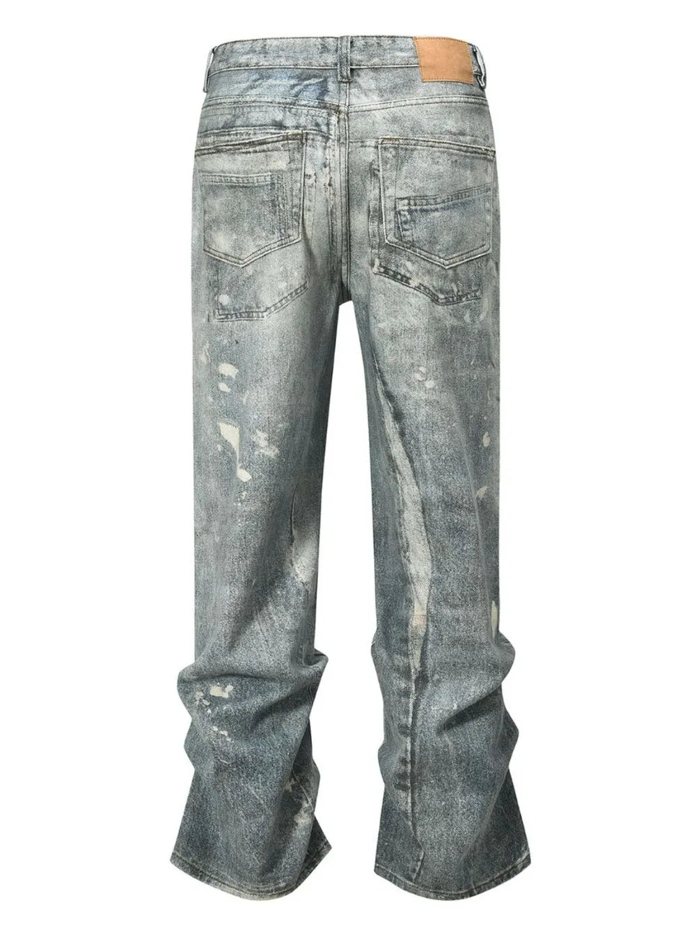 Distressed wide-leg jeans in medium wash denim with painterly details and a relaxed fit.