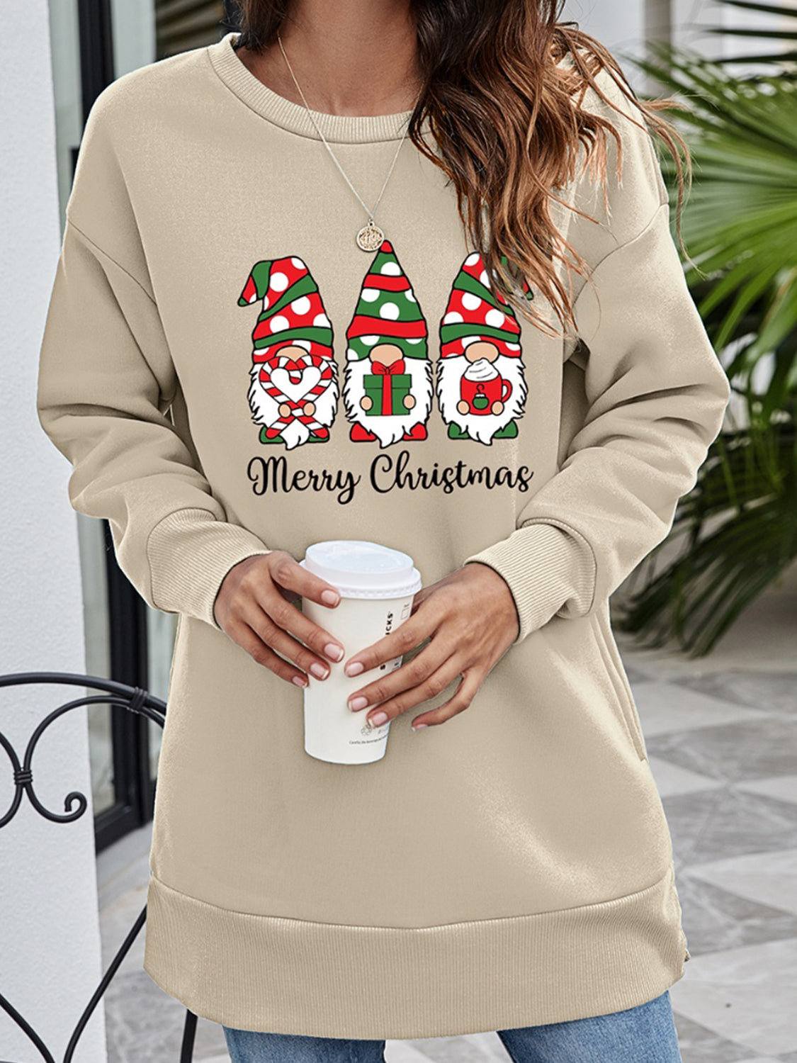 Beige tunic sweatshirt with Christmas gnomes graphic and Merry Christmas text.