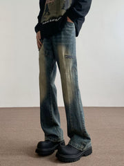 Men's vintage wash blue flare jeans with zipper pocket detail.