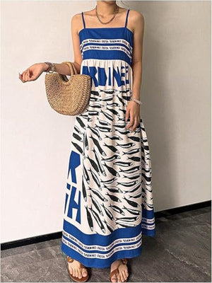 Blue spaghetti strap maxi dress with sardine print and text detail.