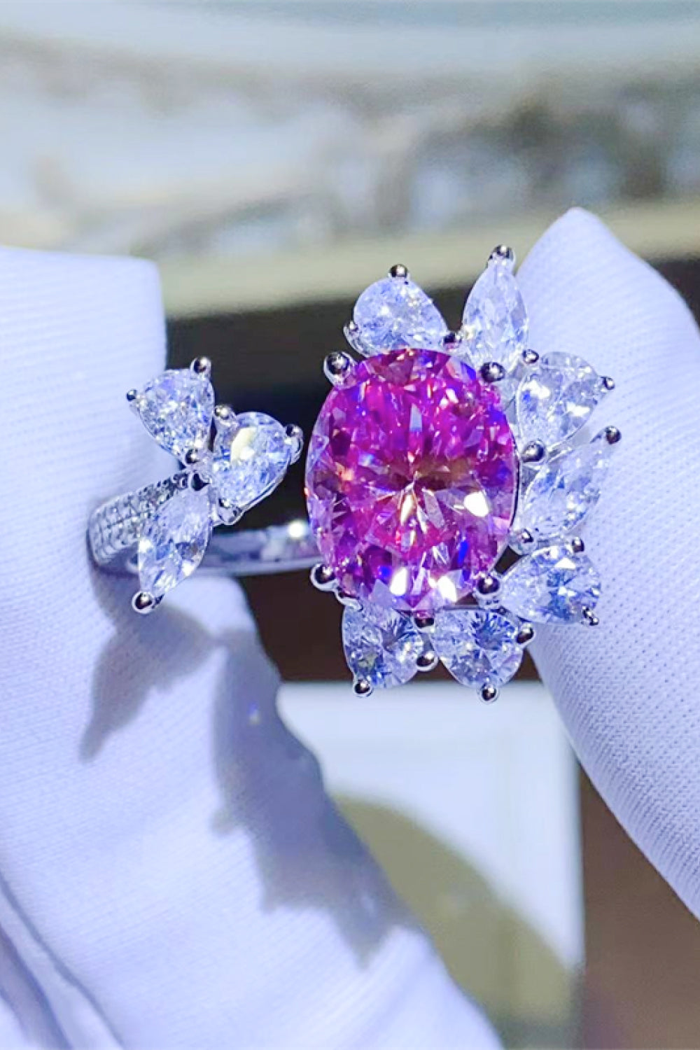 Ring with deep rose oval crystal and clear butterfly design accents.