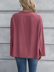 Mandarin collar button-down blouse in a solid color, long sleeves, relaxed fit.
