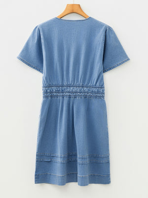 Chic denim dress with elastic waist, short sleeves, and notched neckline.