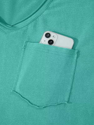 Teal mineral wash cotton tee with V-neck and chest pocket holding a smartphone.