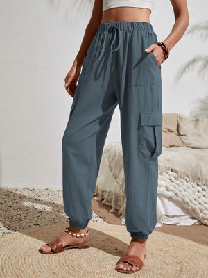 Textured cargo lounge trousers in Dusty Blue with drawstring waist and cuffed ankles.